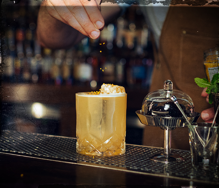 gold rush cocktail being served