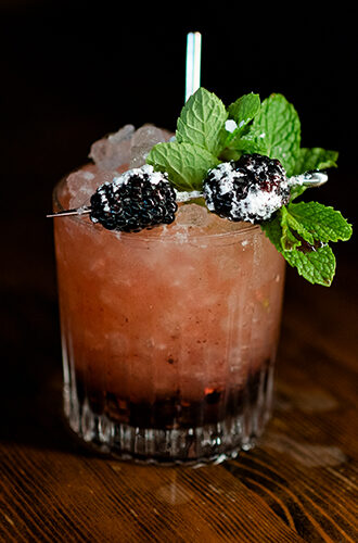 bourbon bramble cocktail being served