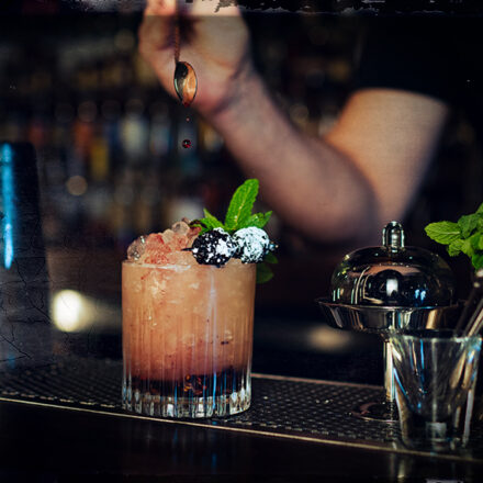 bourbon bramble cocktail being served