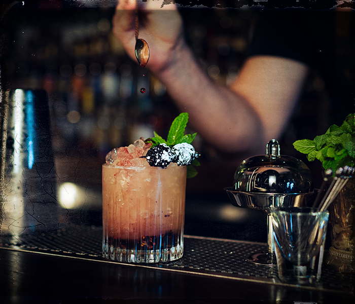 bourbon bramble cocktail being served