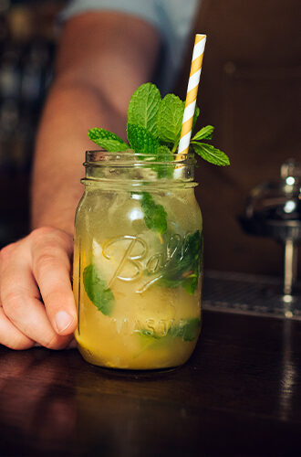 bartender serving mixed drink indiana summer