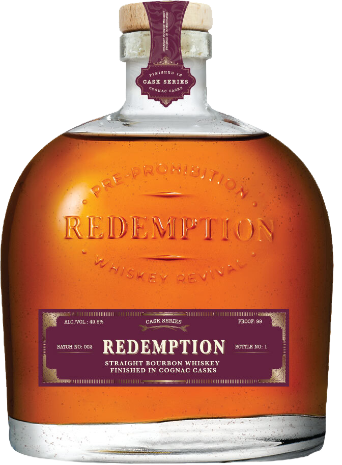 Cognac Cask Finish whiskey bottle on bar counter with snifter glass - Redemption Whiskey