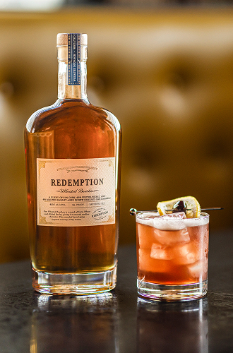 Redemption Whiskey bottle with Wheated 75 Cocktail